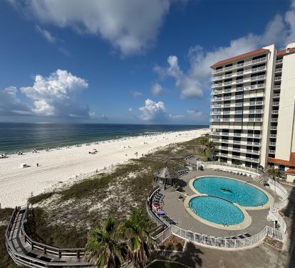 View of outdoor pool. Chair/umbrella service available March - November.