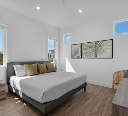 King bedroom with private bathroom and flat screen TV.