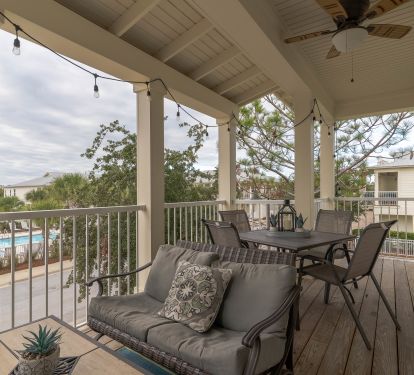 Relax on the porch overlooking the sparkling pool
