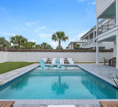 Windsong-24 Private pool with splash deck (seasonally heated between October and April). Multiple seating options for relaxing, dining and sunbathing around the pool.