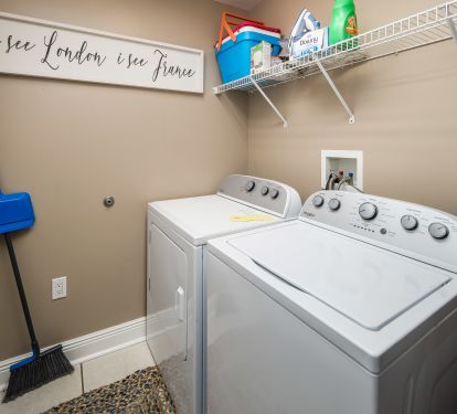 Our laundry room with full sized washer and dryer is stocked with all you need! 