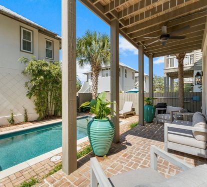 Palms, pavers, and a pool made for all-day lounging