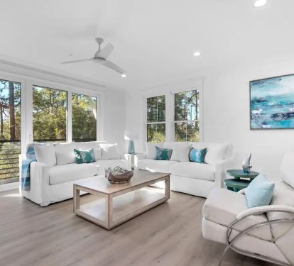 Whimsy-6 first-floor living room offers a blend of style and comfort in its seating arrangements. (Note: The 3rd floor also features its own living space, providing multiple options for your group's comfort and convenience.)
