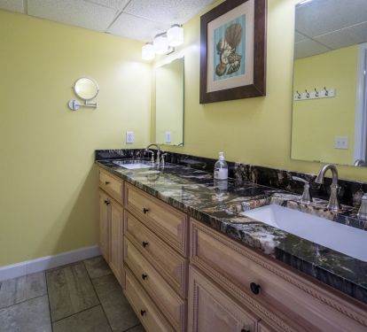 Double vanity w/new cabinets and granite counter tops.  Walkin shower New/Spa