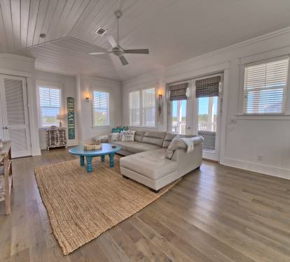 3RD FLOOR LIVING SPACE W/ BALCONY THAT OPENS TO SUMMER KITCHEN