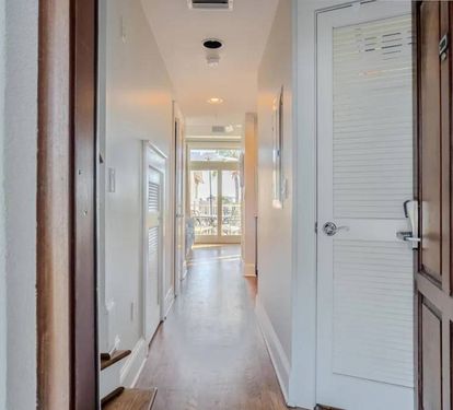Front door entrance, laundry closet on right, Stairs to master suite on left