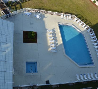 Outdoor pool and hot tub view from Condo 906