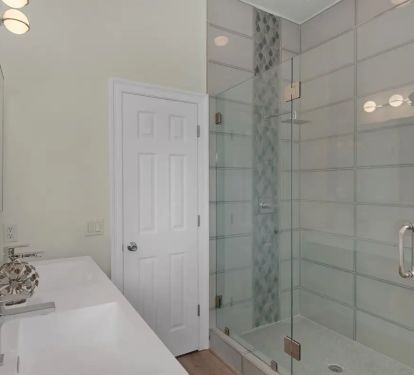 Aqua-13 Decompress in the rainfall shower with glass mosaic of the downstairs king suite.