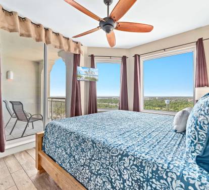 New King size bed in our guest room, with views of the back bays and golf course