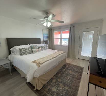 Master bedroom with King bed and private bath with access to balcony