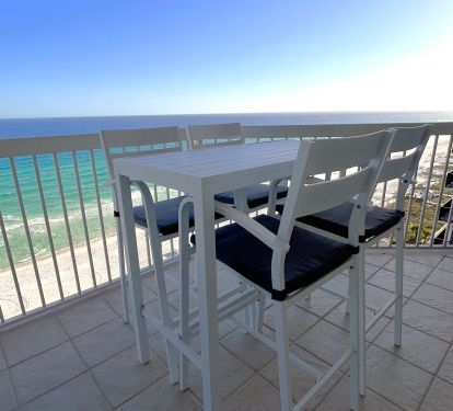 Gulfside balcony dining table and chairs.  