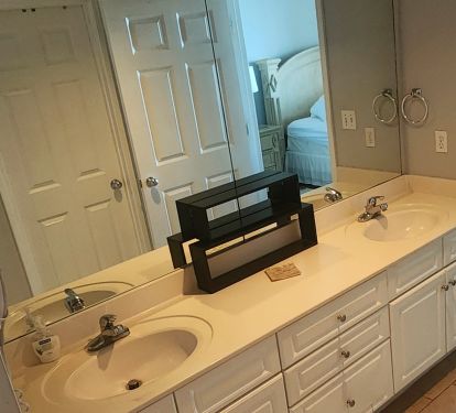 Large master bath with double vanity and walk in closet.