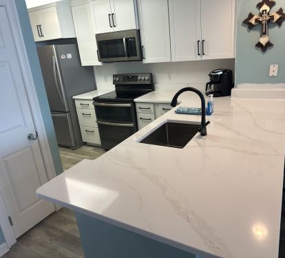Newly remodeled kitchen - shaker cabinets, quartz countertops, double oven
