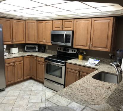 Modern kitchen with granite counter tops and stainless appliances