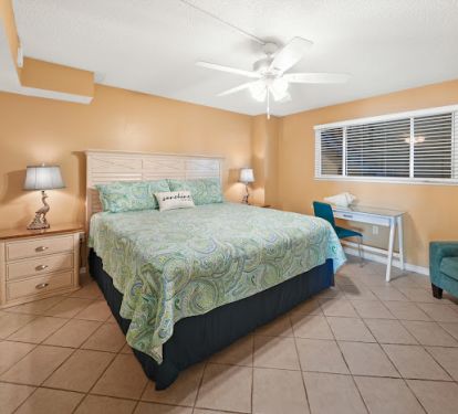 Front guest bedroom with king bed. Study / work desk.