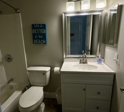 Guest bathroom with tub 