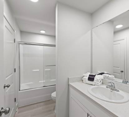 Guest bathroom with tub and shower
