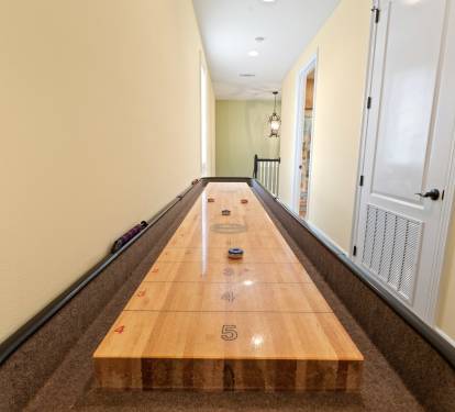 Shuffleboard table and private hall bathroom