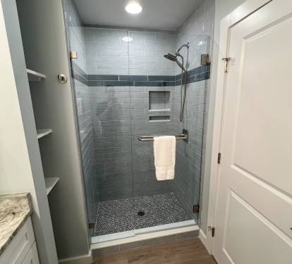 Queen bathroom with tiled shower
