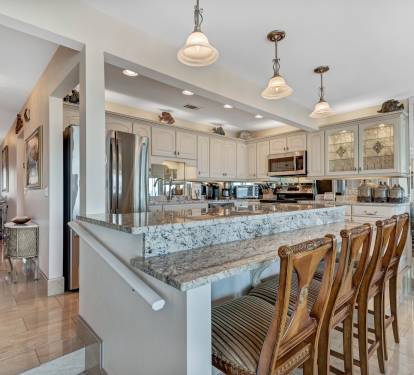 Kitchen with all Stainless Steel Appliances, Eating Bar and Granite Counters