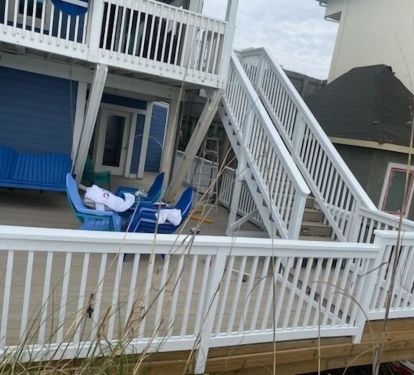 New Trex beach level deck and stairs from ground level balcony