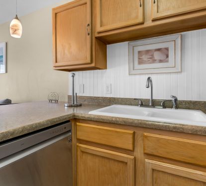 New stainless dishwasher and sink with garbage disposal
