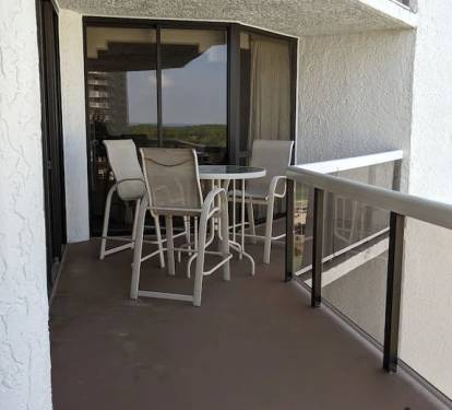 Balcony with seating arrangement and grand skyline