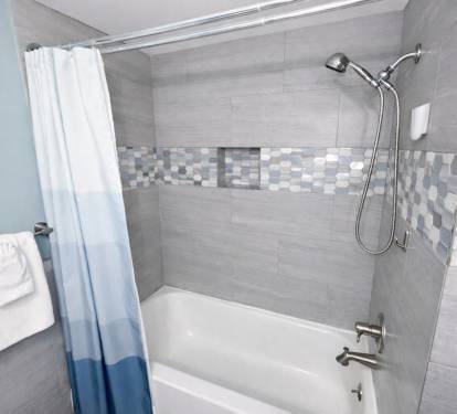 2nd bath - New tile with tub and built in niche.