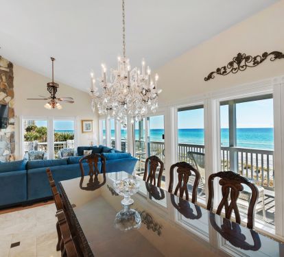View of dining room into living room, showing spectacular views of he ocean