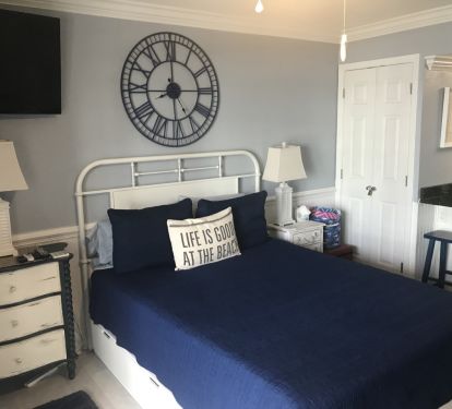 Comfortable Queen bed with drawers underneath; TV to watch from the couch.