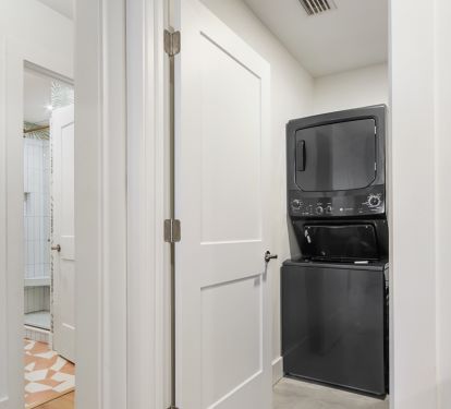 Laundry room with extra full size refrigerator