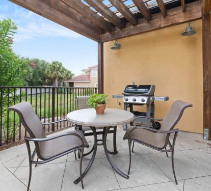 Pergola patio and large grill.  Just off the pool area.