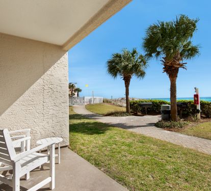 lawn area for kids to run around and steps away from gated pool