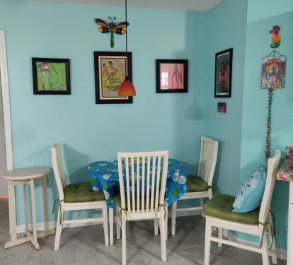 dining area - table folds out into a round, seating for 4.