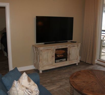 Huge 65 inch Samsung TV. An HDMI cable is provided for connecting a laptop