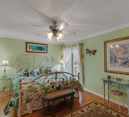 Master bedroom with adjacent master bathroom