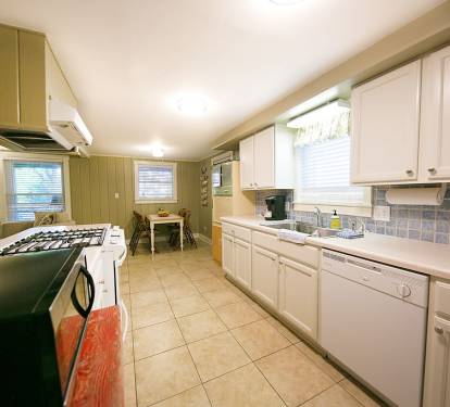 Kitchen with gas stove, pantry, and all needed utensils and cookware
