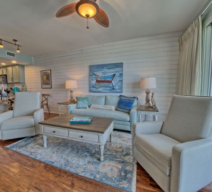 Living area with ceiling fans track lighting!