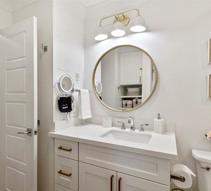 Makeup mirror &amp; lots of light provided in bathroom