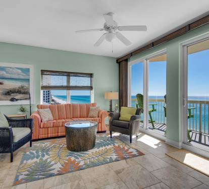 Living room - 2 sliding doors onto balcony 2 side windows view the coastline.