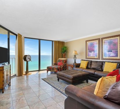 Living room with beautiful view. Has two full length leather sofas. 