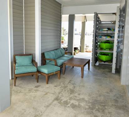 2 TANDEM KAYAKS &amp; 2 PADDLE BOARDS - CARPORT SEATING AREA