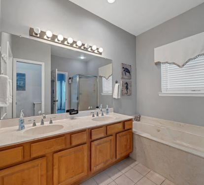 Master bath with jet tub, shower, and his/her vanity!