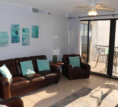 Living Room with Balcony Access and view of Gulf