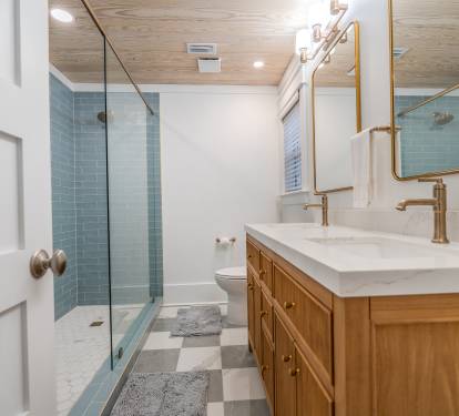 Newly remodeled ensuite bath for first floor primary. Large walk in shower.