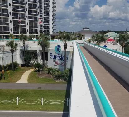 Sky walk from Beach/tiki bar over scenic 98 hwy to pool/restaurant at Surfside