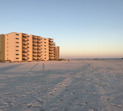 Beach view and condos from Phillips Inlet at sunset