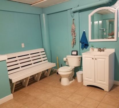 Carport/pool bathroom with extra full size fridge/freezer.  Outdoor shower also.