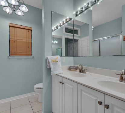 In-law studio also has full bath with shower and double sinks and toilet.