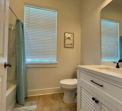 Private bathroom for bedroom 2 with shower/tub combo
